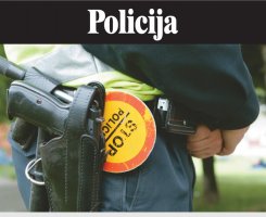 policajac, detalji - pištolj i znak stop